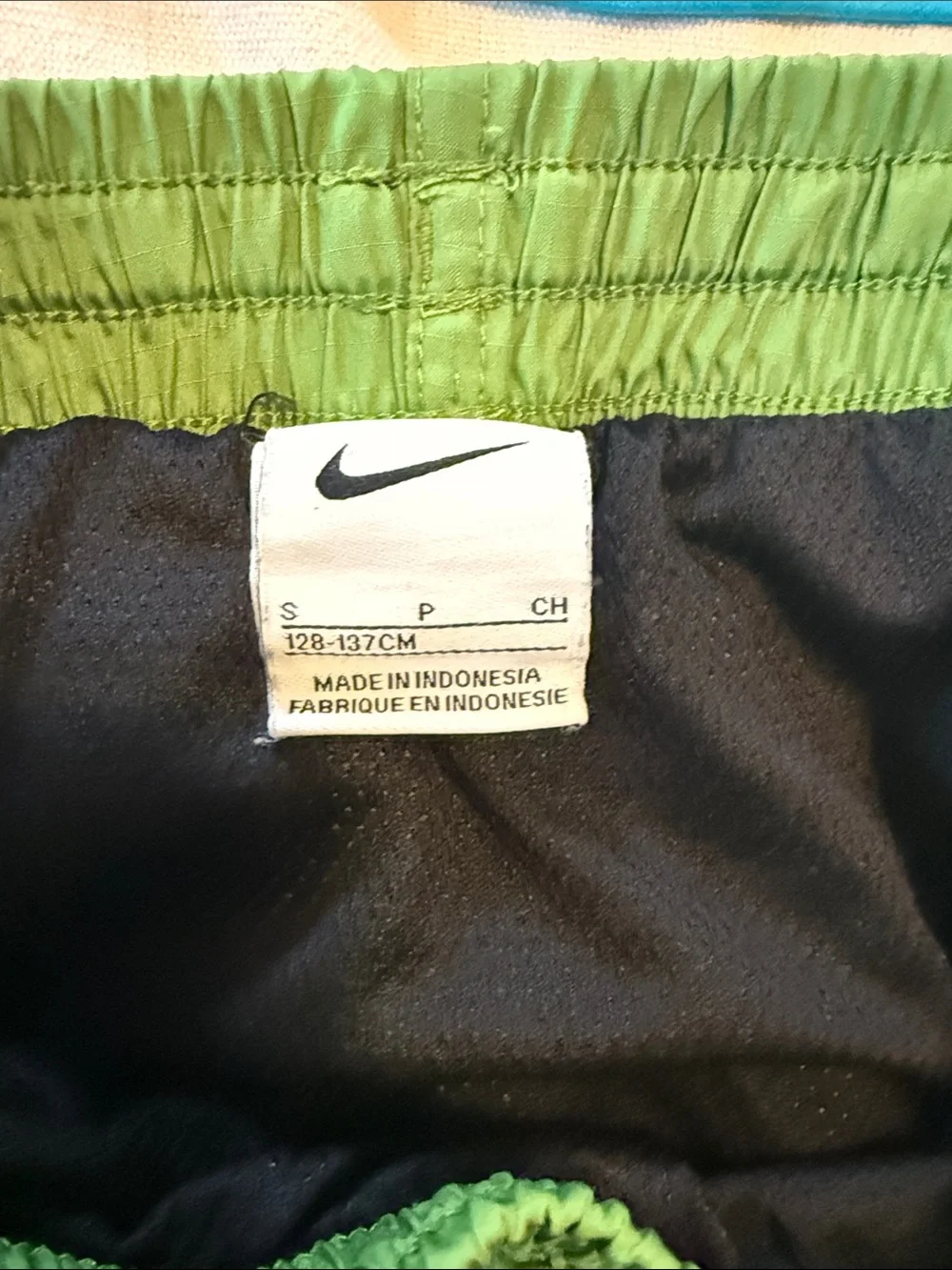 Two sets, Nike rash guard/swim shorts, size small (boys 8-10)